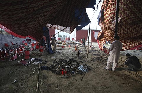 Shoes of victims are gathered after Sunday's suicide bomber attack, in the Bajur district of Khyber Pakhtunkhwa, Pakistan, Monday, July 31, 2023. (Photo | AP)