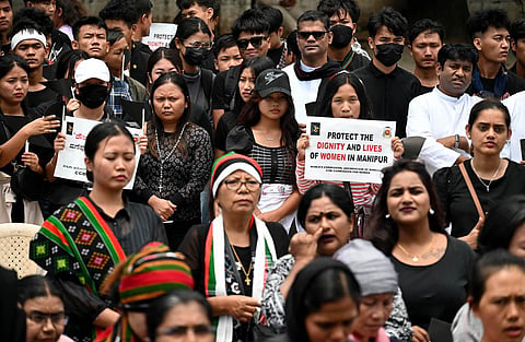 People protest against the atrocities on women and violence in Manipur, in Bengaluru on Sunday. (Photo | Shashidhar Byrappa)