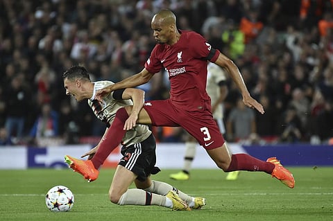 FILE - Liverpool's Fabinho (R), is challenged by Ajax's Steven Berghuis during the Champions League group A soccer match between Liverpool and Ajax at Anfield stadium in Liverpool,. (Photo | AP)