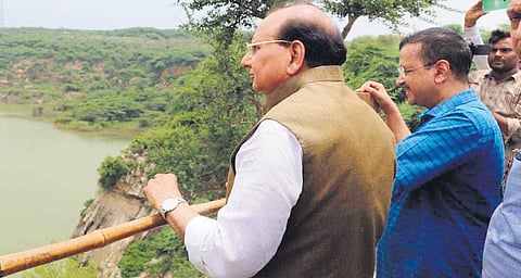 Chief Minister Arvind Kejriwal and L-G VK Saxena pose for a photograph during a visit to Asola Bhatti Wildlife Sanctuar. (Photo| Express)