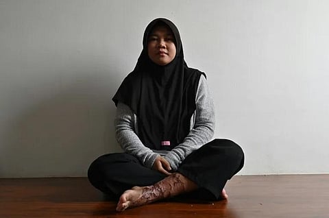 'Let me be the last to suffer': Siti Khotimah (Photo | AFP)