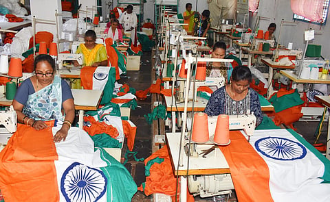Women employees of Khadi Federation near Hubballi work full-time to meet the orders of National Flag for Independence Day. (Photo | D Hemanth)
