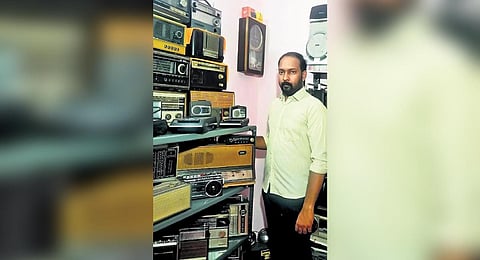 Aby Isaac, a 38-year-old state government employee and his collection of over 400 antique radios and tape recorders.