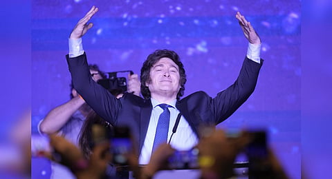 Javier Milei, presidential candidate of the Liberty Advances coalition, raises his arms at his campaign headquarters in Buenos Aires, Aug. 13, 2023. (Photo | AP)