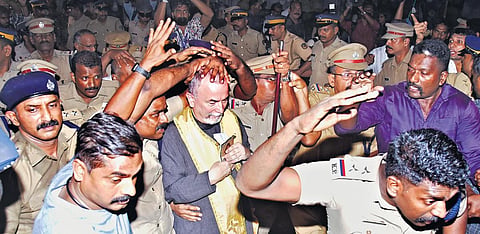 Police officers make a human shield to protect papal delegate Archbishop Cyril Vasil from protesters when he entered Ernakulam St Mary’s Basilica on Monday evening. (Photo | A Sanesh)
