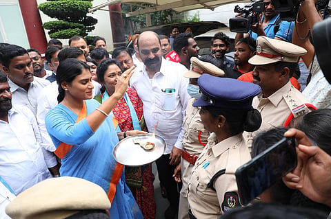 YSRTP president YS Sharmila offers aarti to a police personnel on Friday. (Photo | Express)