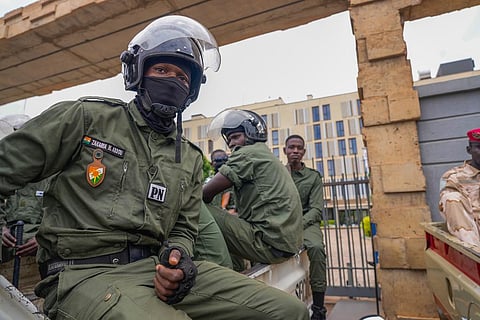 Nigerien police officers sit outside the customs offices in Niamey, Niger, Monday, Aug. 21, 2023. (Photo | AP)