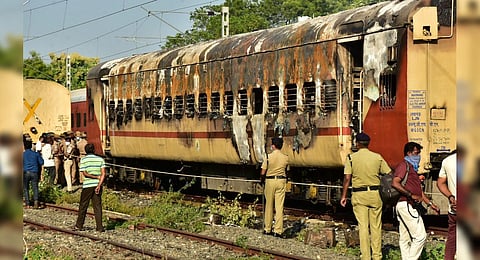 Security personnel at the spot after a fire broke out in a coach of a train at Madurai railway station, Saturday. (Photo | PTI)