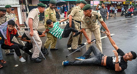 Police detain students at a protest during a 12-hour statewide bandh called by Twipra Students' Federation demanding adoption of Roman script for Kokborok language, in Agartala, Aug. 28, 2023. (PTI)