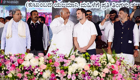 Chief Minister Siddaramaiah and Deputy Chief Minister DK Shivakumar look on during the launch of Gruha Lakshmi scheme. | Udayashankar S