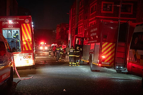 Fire fighters work on the scene of a deadly blaze that claimed the lives of dozens of people in downtown Johannesburg. (Photo | AP)