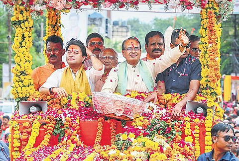 Chief Minister Shivraj Singh Chouhan with Union minister Jyotiraditya Scindia during a roadshow in Gwalior, on Sunday | PTI