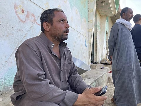 Ashraf Sadawy Abdel-Fattah sits outside his home in the farming village of Nazlet el-Sharif, Egypt on Sept 14, 2023. (Photo | AP)