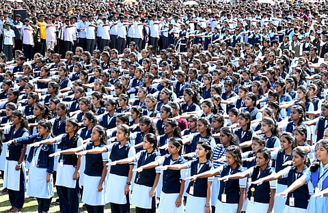 Students read out the Preamble of the Constitution on ‘International Day of Democracy’ in Mysuru on Friday. (Photo | Udayashankar S)