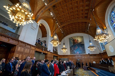 All rise as judges, rear, enter the World Court where Ukraine's legal battle against Russia over allegations of genocide used by Moscow to justify its 2022 invasion, resumed in The Hague. (Photo | AP)