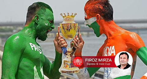Fans with their bodies painted as national flags of India and Pakistan hold a cut-out of the Asia cup trophy in Ahmedabad on September 1, 2023. (Photo | AFP)