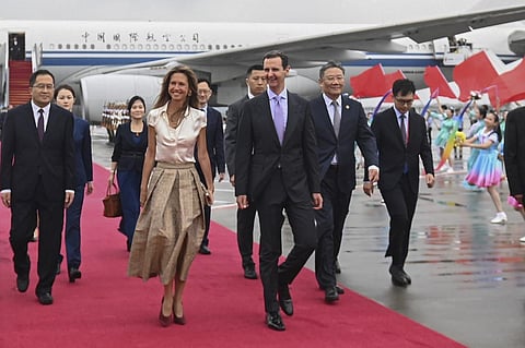 Syrian President Bashar Assad, center right, and first lady Asma Assad arrive in Hangzhou, China, on Sept. 21, 2023. (Photo | AP)