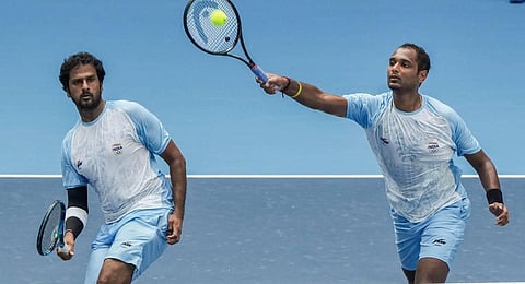 India's Ramkumar Ramanathan and Saketh Myneni (L) in action during men's doubles final tennis match against Chinese Taipei's Yu-Hsiou Hsu and Jason Jung at the 19th Asian Games. (Photo | PTI)