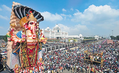 Thousands of people gather to catch a glimpse of the 63-foot-tall Khairatabad Ganesh idol in Hyderabad on Thursday | vinay Madapu
