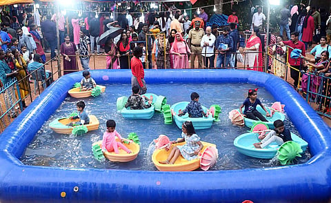 Children enjoying at an amusement park set up at the Kanakakunnu ground in connection with the Onam week celebrations organised by the state tourism department in Thiruvananthapuram.| Vincent Pulickal