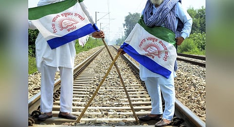 Punjab Mazdoor Sangharsh Committee activists block railway tracks during a protest demanding flood compensation, MSP guarantee law and debt relief in Amritsar, Sept. 28, 2023. (Photo | PTI)