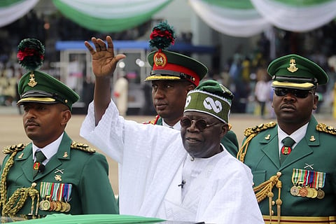 Nigeria's new President Bola Ahmed Tinubu inspects honour guards after taking an oath of office at a ceremony in Abuja, Nigeria on May 29, 2023. (Photo | AP)