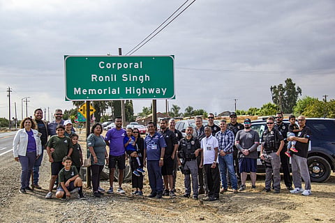 Signage proclaiming the 'Corporal Ronil Singh Memorial Highway' stands at Highway 33 and Stuhr Road. (Assemblyman Juan Alanis Twitter)