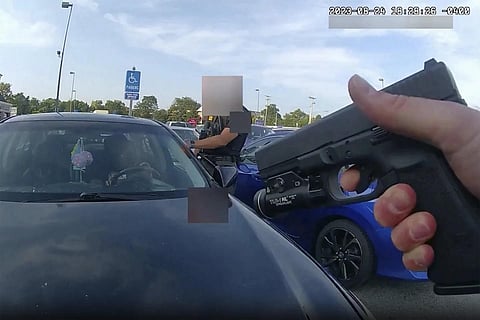 This image from bodycam video released by the police Sept 1, 2023, shows an officer pointing his gun on Ta’Kiya Young moments before shooting her through the windshield...(Photo | AP)