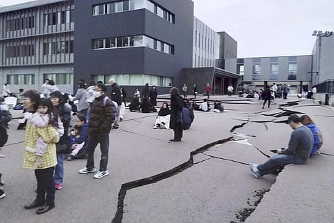 Cracks are seen on the ground in Wajima, Ishikawa prefecture, Japan, following an earthquake (Photo | AP)