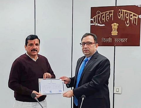 AAP Rajya Sabha candidate Sanjay Singh receives his certificate from Returning Officer Ashish Kundra after he was elected unopposed, in New Delhi | PTI