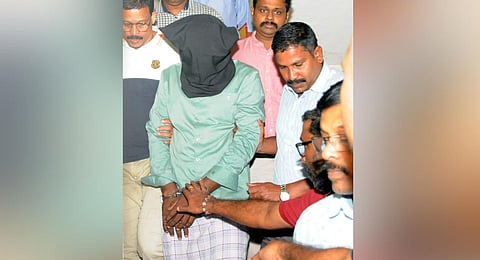 Savad who chopped the right hand of Professor TJ Jospeh in 2010 was arrested by NIA from Mattannur in Kannur and being produced at a court in Kochi on Wednesday.(Express)