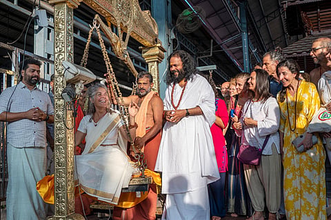 All 27 foreign devotees performed 'thulabharam' using the water from the Manikinar. (Photo | Express)