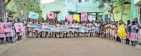 Kalvarayan Hills Government Tribal School girl students holding up gender awareness posters they had made as part of an AWARE workshop | Express