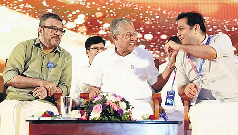 Chief Minister Pinarayi Vijayan sharing a light moment with MP Hibi Eden during the inaugural function of K-SMART application developed by the Information Kerala Mission in Kochi on Monday. Minister M