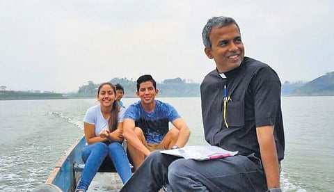 (R) Fr Joshy with his parishioners