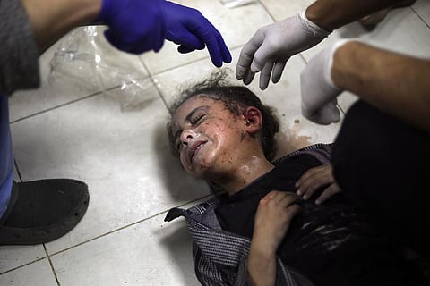 A Palestinian child wounded during the Israeli bombardment of the Gaza Strip receives treatment at the Nasser hospital in Khan Younis, Southern Gaza Strip. (Photo | AP)