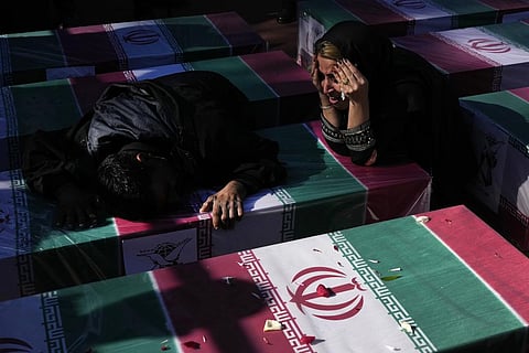 Mourners weep over the flag-draped coffin of their loved one who was killed in Wednesday's bomb explosion. (Photo | AP)
