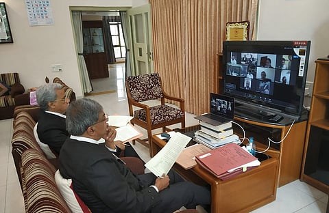The matter was hearing by a Division Bench of the Court via videoconferencing