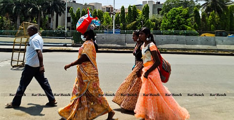 Migrants and Students walking