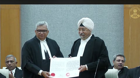 Acting Chief Justice Nitin Wasudeo Sambre administers oath to Justice Gurvinder Pal Singh