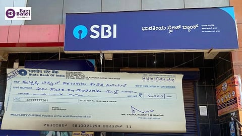 ಕನ್ನಡದಲ್ಲಿ ಬರೆದ ಚೆಕ್ ಅಮಾನ್ಯ; ಹೊಣೆಗೇಡಿತನ ತೋರಿದ ಎಸ್ಬಿಐಗೆ ₹85 ಸಾವಿರ ದಂಡ ವಿಧಿಸಿದ ಗ್ರಾಹಕರ ಆಯೋಗ