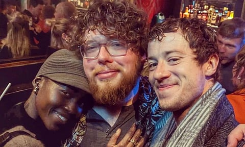 Director Michael Sarnoski( with Lupita Nyong'o( L) and Joseph Quinn (R)