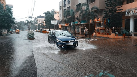 A car finds the way through the underwater road in Vasco city (Goa) on Friday,15 July,2021