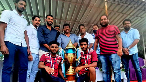 Mitchell Lobo with the winning team at the football tournament at Siolim. Goa