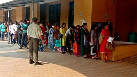 People standing in a queue outside District Hospital for RTPCR Test 