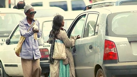 beggars and vendors near traffic signals