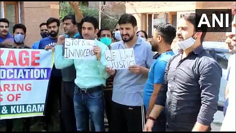 Members of Kashmiri Pandit Employees protest