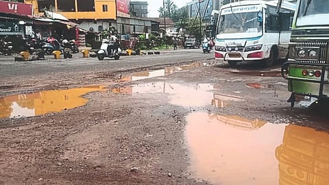 Mud at an alternative bus station in Bicholim due to rain