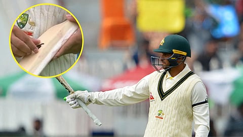 Usman Khawaja forced to remove dove bat sticker