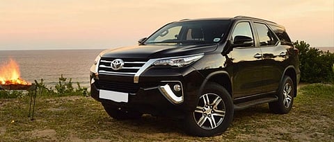 Goa Gajaad driving a luxury car on the shores of Morji